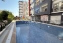 KIZKALESİ MERKEZDE DENİNZ MANZARLI VE HAVUZLU SATLIK  1+1 DAİRE