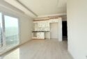 KIZKALESİ MERKEZDE DENİNZ MANZARLI VE HAVUZLU SATLIK  1+1 DAİRE
