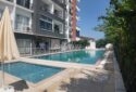 KIZKALESİ MERKEZDE DENİZ MANZARLI VE HAVUZLU SATLIK  1+1 DAİRE