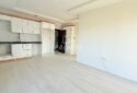 KIZKALESİ MERKEZDE DENİZE MANZARALI VE HAVUZLU SATILIK 1+1 DAİRE