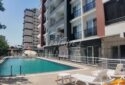 KIZKALESİ MERKEZDE DENİZE MANZARALI VE HAVUZLU SATILIK 1+1 DAİRE